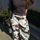 COW PRINT WIDE LEG PANTS